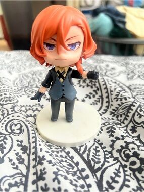 Orange-haired Chibi Figure in Suit